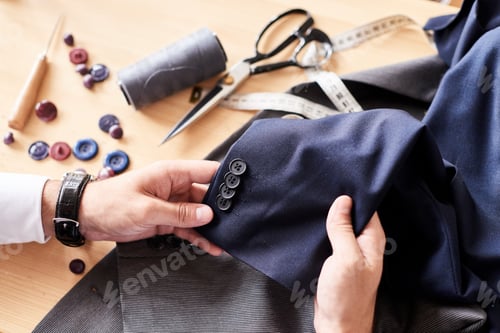 Preview: Craftsman Working on a Suit Jacket Alteration