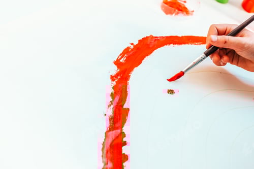 Preview: Young boy learns to paint with a brush on a paper canvas, letting his imagination run wild