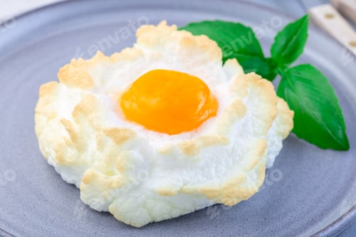 Preview: Oven baked cloud or fluffy egg dish on gray plate, horizontal, closeup