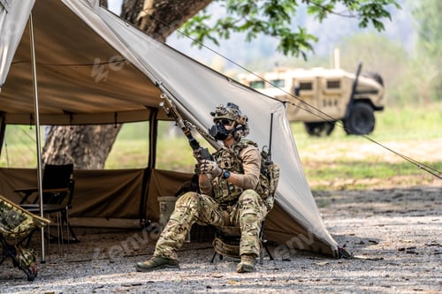 Preview: Special forces soldiers preparing tactical gear at military field base camp
