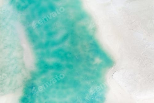 Preview: A view from a height of a Tropical beach and waves breaking on a tropical golden sandy beach. The