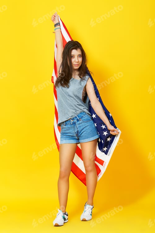 Preview: young woman holding american flag