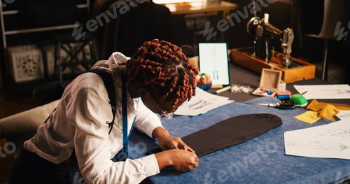 Preview: African american tailor preparing fabric