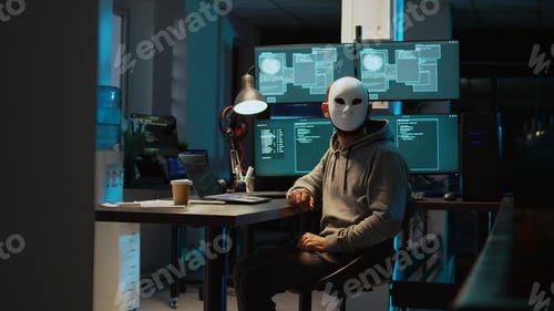 Preview: Web terrorist wearing mask hacking database servers