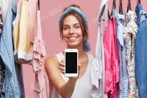 Preview: People, style, fashion, shopping and modern technologies concept. Portrait of attractive joyful girl