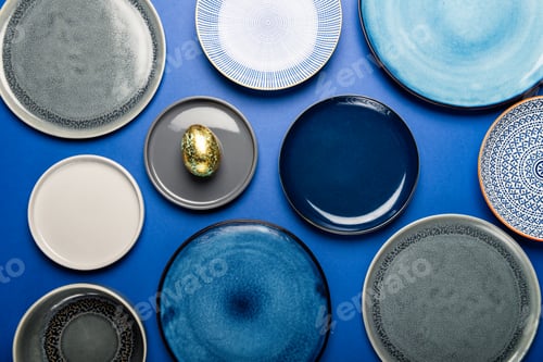 Preview: Different Plates with Easter Egg on blue background