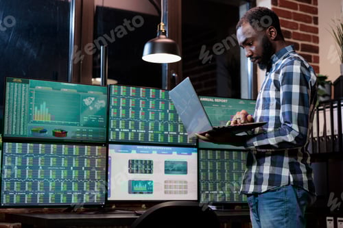 Preview: Investment agency stock market trader having laptop analyzing market trend using real time data.