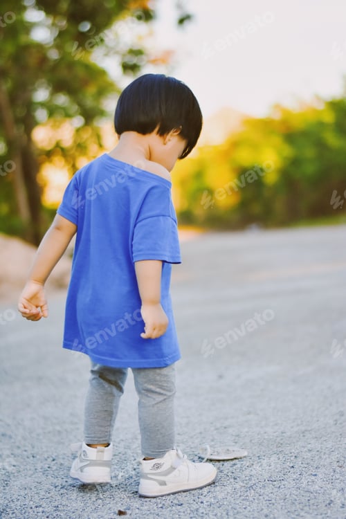 Preview: Happy little asian boy enjoying himself at the Park in Thailand.