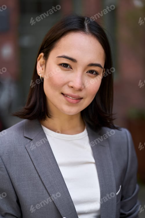 Preview: Young confident elegant Asian business woman, vertical headshot portrait.