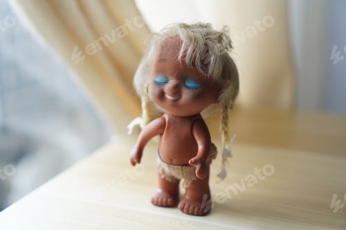Preview: baby girl doll on wooden table