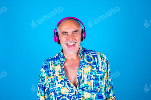 Preview: Senior man laughing listening music isolated background