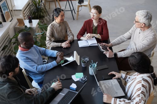Preview: Diverse Team of People in Business Meeting Above View