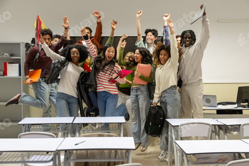 Preview: Diverse students celebrating success jumping in classroom