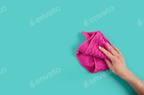 Preview: Woman's hand holding rag. Set for cleaning windows