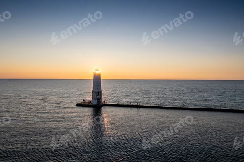 Preview: Aerial view of the lighthouse in Frankfort, Michigan at sunset