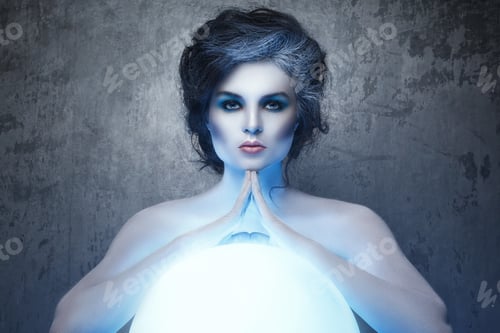 Preview: Woman in creative makeup and body-art in image of a soothsayer