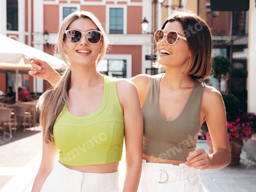 Preview: Two beautiful women posing outdoors
