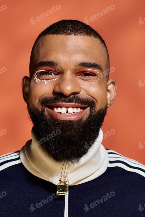 Preview: Handsome young man with stylish look smiling confidently against a vibrant background