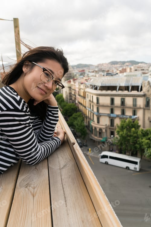 Preview: Lovely young woman on terrace