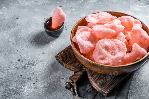 Preview: Crunchy kerupuk prawn shrimp crackers, chips. Gray background. Top view. Copy space