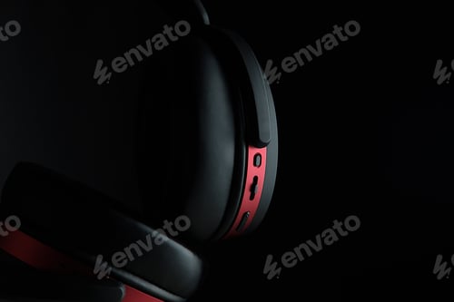 Preview: Black and red headphones on black.