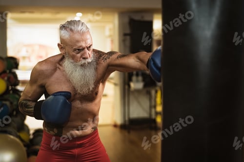 Preview: Senior man boxing in sport gym center club - Health fitness and sporty activity concept