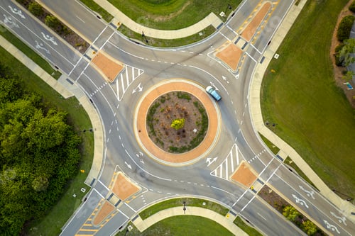 Preview: Aerial view of road roundabout intersection with moving cars traffic.