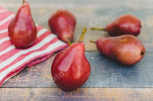 Preview: Ripe juicy organic red pears on a rustic wooden table, the perfect fall fruit