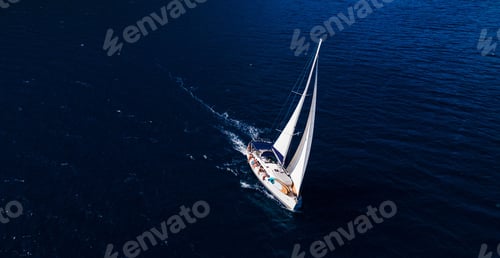 Preview: Drone shot of a white boat on the surface of a sea, cool for background