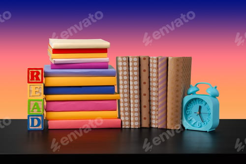Preview: Stack of books on black wooden table