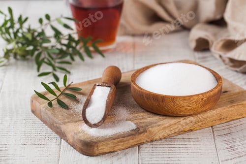 Preview: Natural sweetener in a wooden spoon. Sugar substitute. Erythritol