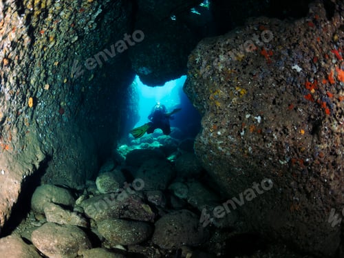 Preview: diving through a hole between rocks on the seabed
