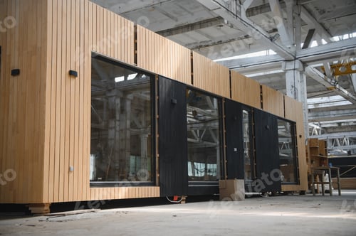 Preview: A new wooden modular prefabricated house inside in manufacturing facility