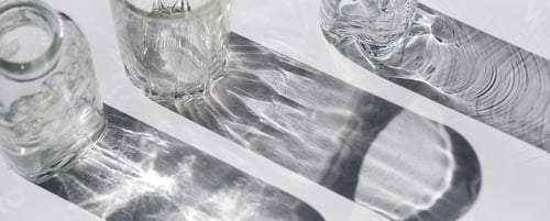 Preview: glasses and shadows. glass with sparkling sunlight shadow. unlight and blank business