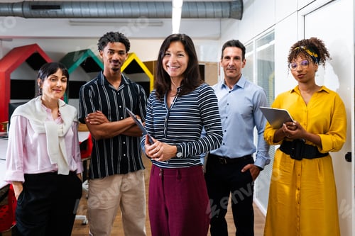 Preview: Startup business team posing in modern office