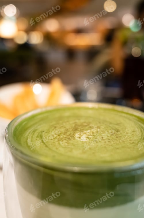 Preview: Cup Of Matcha Milk Tea On Table In A Coffee Shop