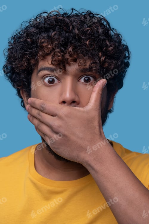 Preview: Dark-haired young man with a shocked expression