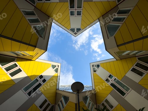 Preview: Cube houses in Rotterdam Netherlands. Yellow color modern architecture design. Low angle view