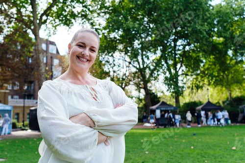 Preview: Portrait of mature woman with arms crossed.