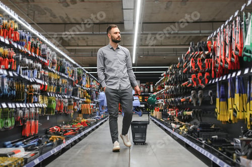 Preview: male builder in a hardware store
