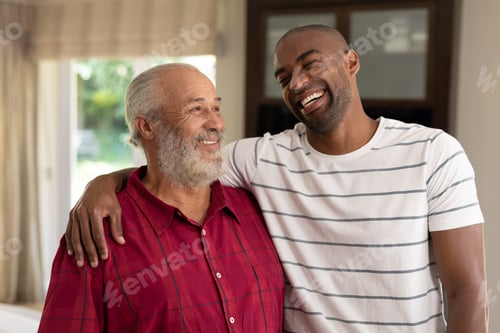 Preview: Two men smiling at home