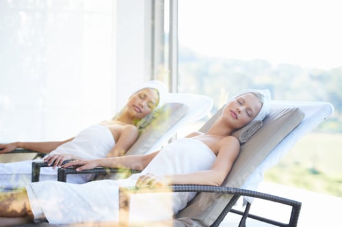 Preview: Relaxed Women Reclining in Chairs with White Towels