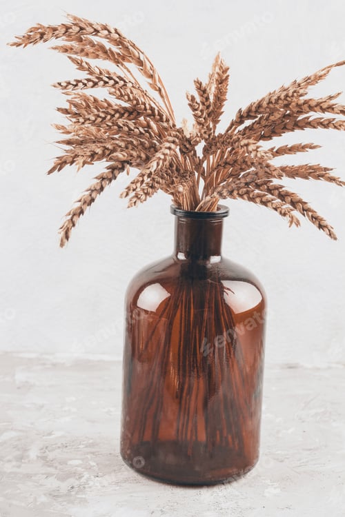 Preview: brown glass vase with ears on a gray shabby background