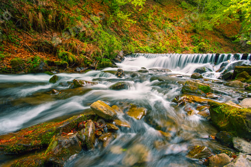 Preview: Waterfall on mountain river in autumn forest