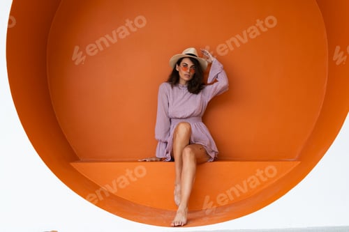 Preview: Fashionable Woman Posing in Orange Circular Niche