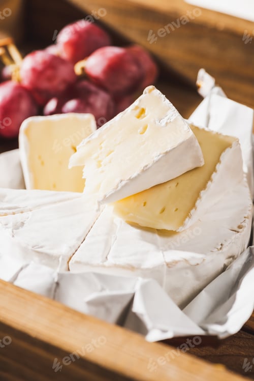 Preview: Close up View of French Breakfast With Camembert And Grape on Wooden Tray