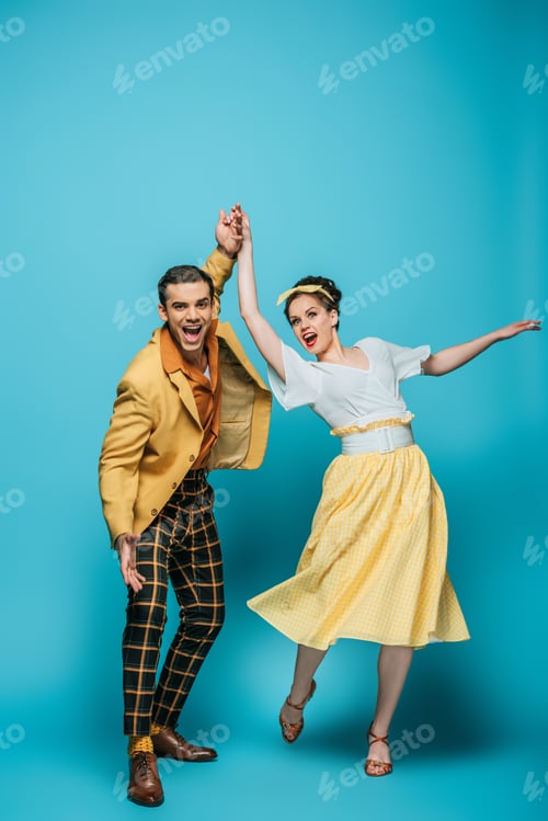 Preview: happy dancers holding hands while dancing boogie-woogie on blue background