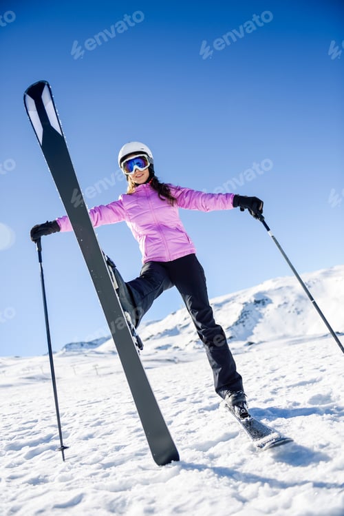 Preview: Happy woman in snow-covered landscape in Sierra Nevada, Andalusia, Spain