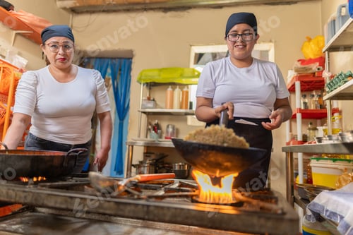 Preview: Peruvian cook preparing Chaufa rice in a commercial kitchen