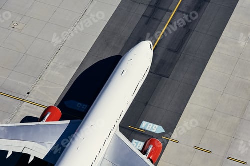 Preview: Aerial view of plane at airport. Airplane taxiing to runway before take off.